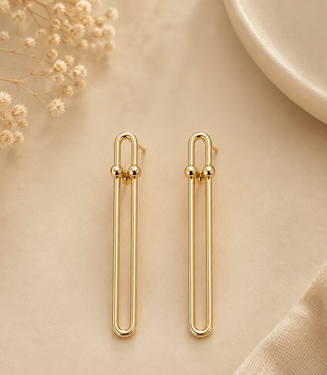 Brinco Paperclip Alongado — elo vazado banhado a ouro 18K